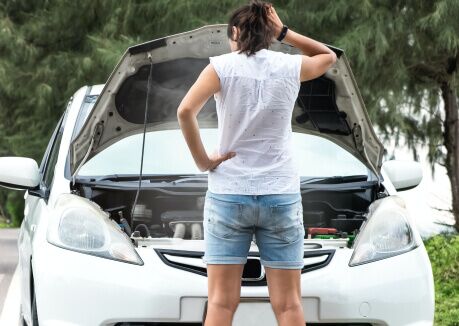 woman inspecting lemon car